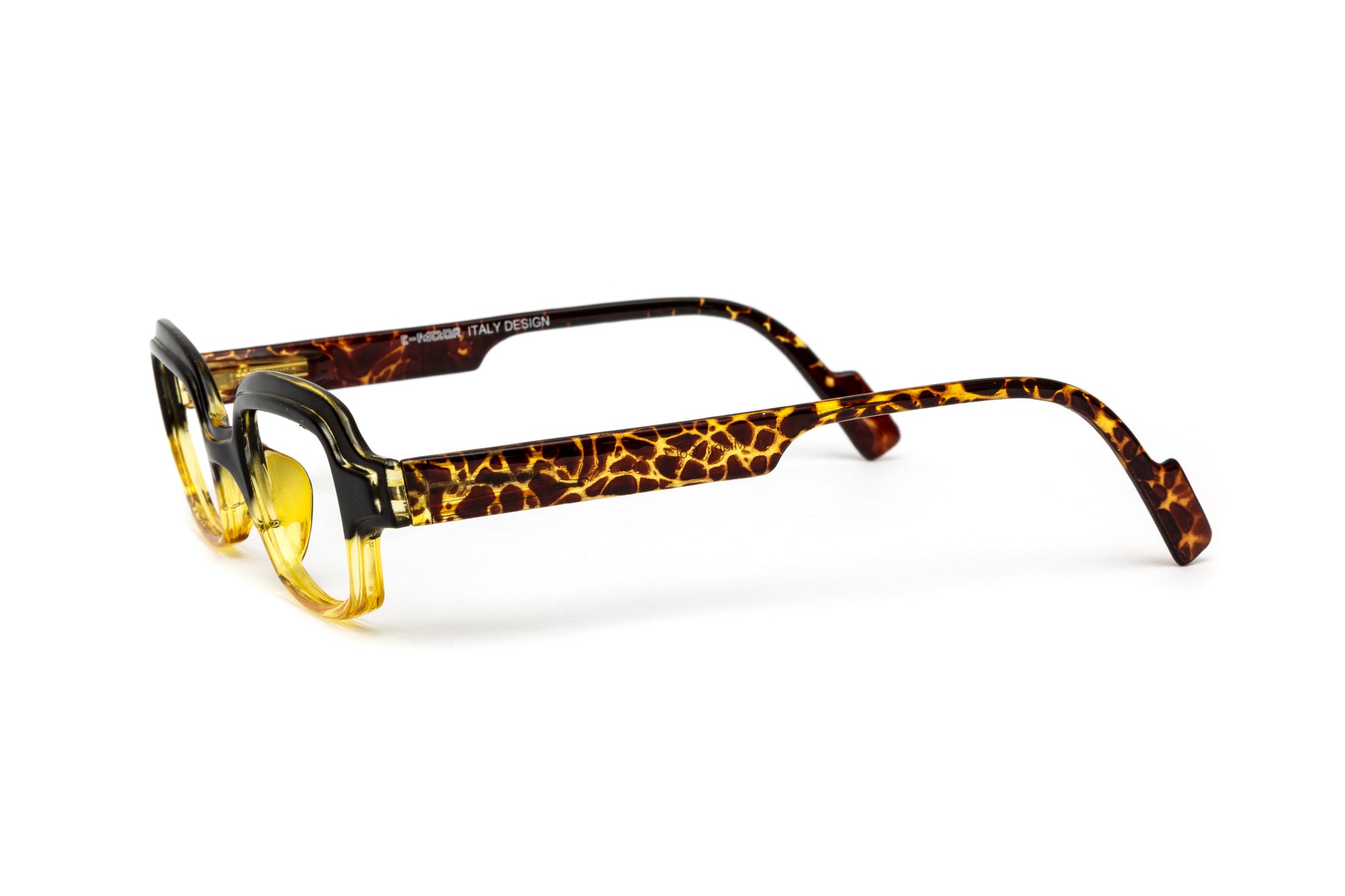 Square funky unisex reading glasses in striking yellow with stylish animal print details. These designer reading glasses feature a contemporary frame, blending bold colors and trendy patterns, perfect for fashion-forward individuals seeking a unique accessory for reading and everyday wear