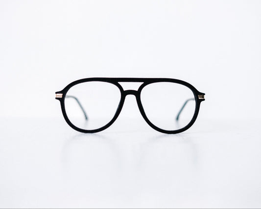 Front view of black velvet aviator glasses with matte black temples, displayed on a white background. The soft velvet texture gives a luxurious finish, available as reading glasses or blue light blocking glasses.