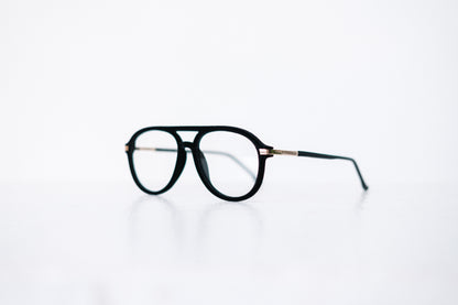 Side view of black velvet aviator glasses with matte black temples, displayed on a white background. The soft velvet texture gives a luxurious finish, available as reading glasses or blue light blocking glasses.