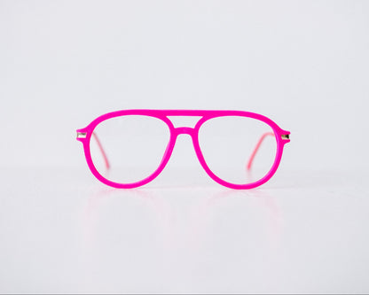 Front view of pink velvet aviator reading glasses displayed on a white background, showing the soft velvet texture and sleek, modern silhouette.