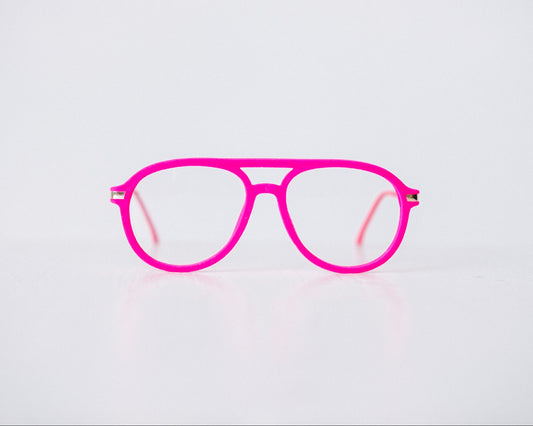 Front view of pink velvet aviator reading glasses displayed on a white background, showing the soft velvet texture and sleek, modern silhouette.
