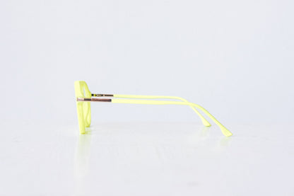 Side view of neon green and neon yellow velvet aviator glasses with matte temples, displayed on a white background. The bold, vibrant frame features a soft velvet texture and is available as reading glasses or blue light blocking glasses.